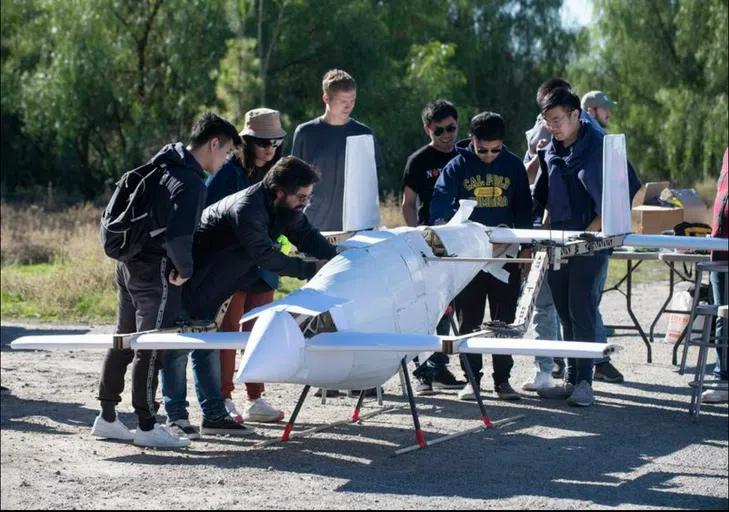 students engineering a model plane