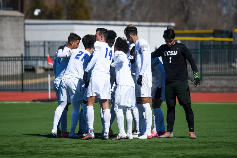 Men's Soccer Team huddling up!