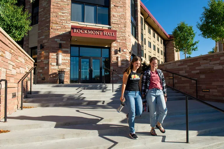 students walking down the steps of Rockmont Hall