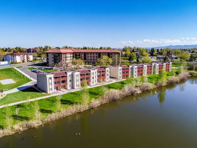 Part of a pond, followed by CCU's apartment style living