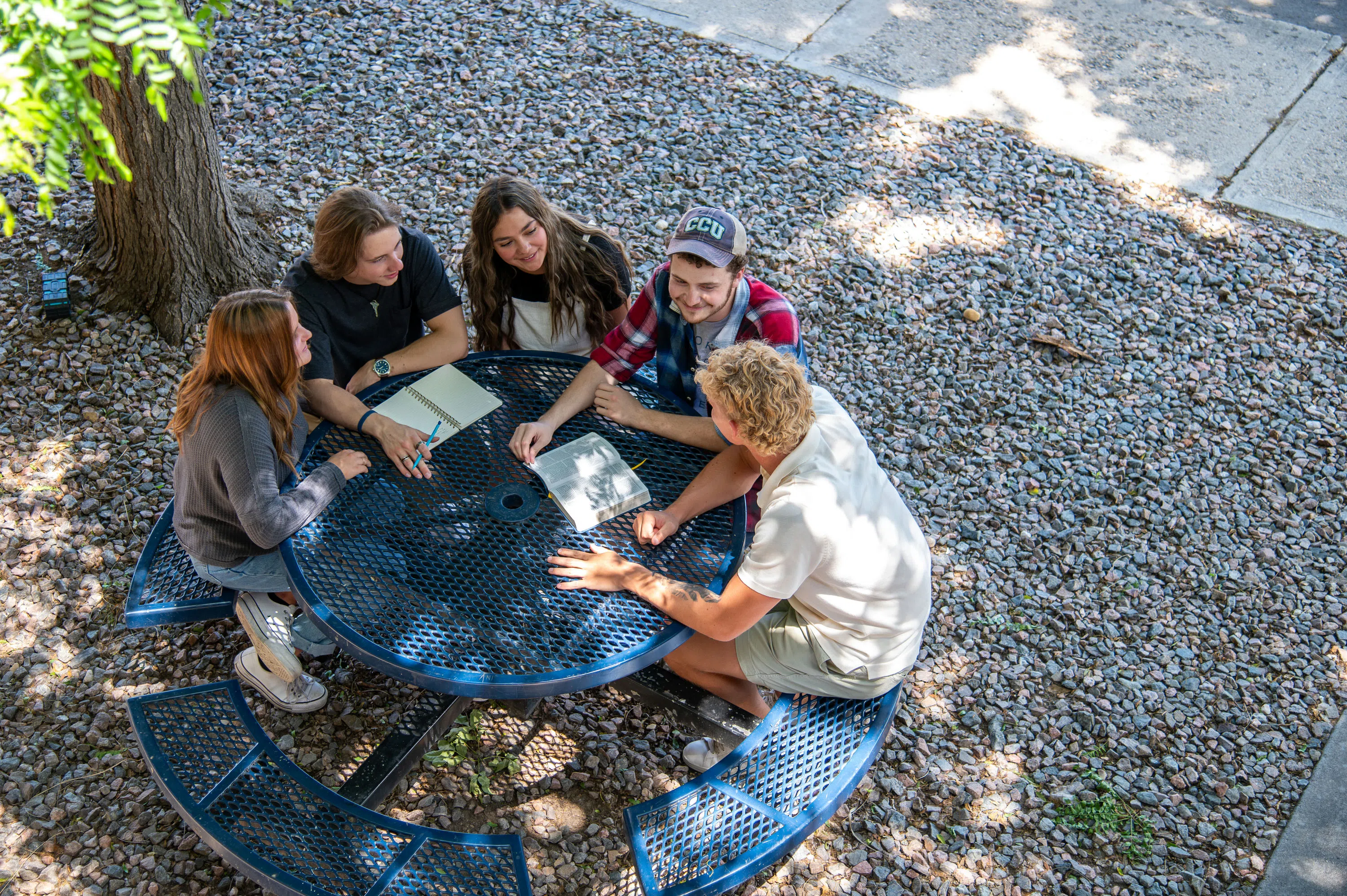 Picnic tables outside The Row are great spots to connect with friends during the warmer months.