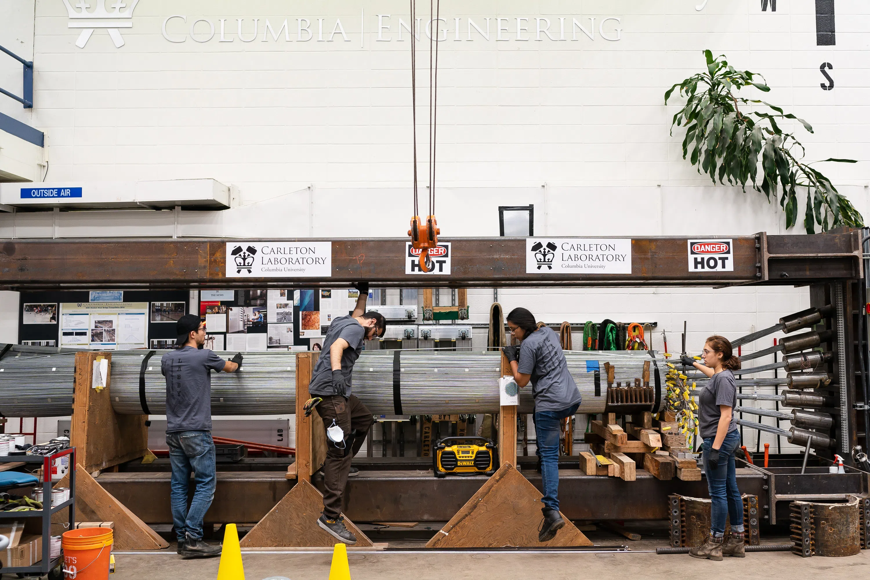 Four students are working in a construction lab.