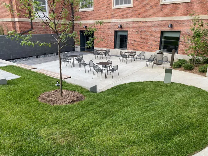 One of two for Center for Campus Life patios, complete with lush green hills and plenty of patio furniture