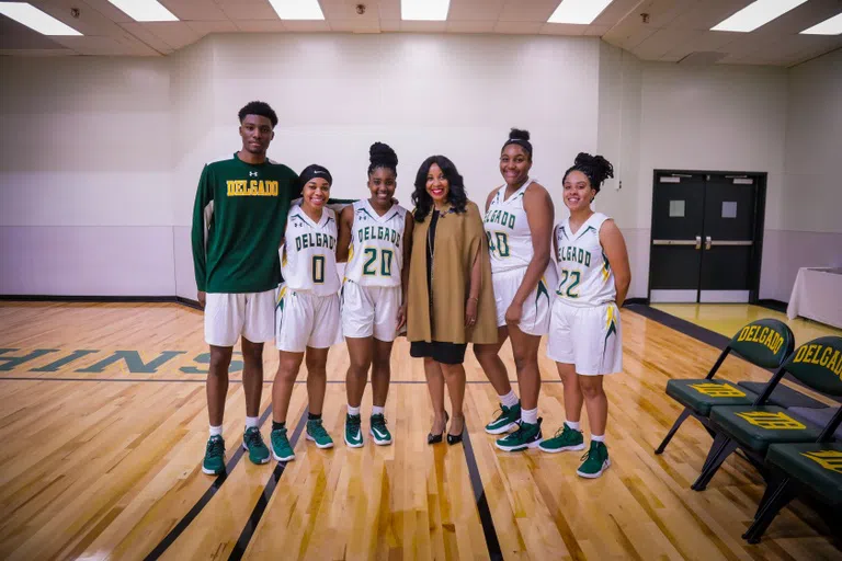 basketball players standing together on court