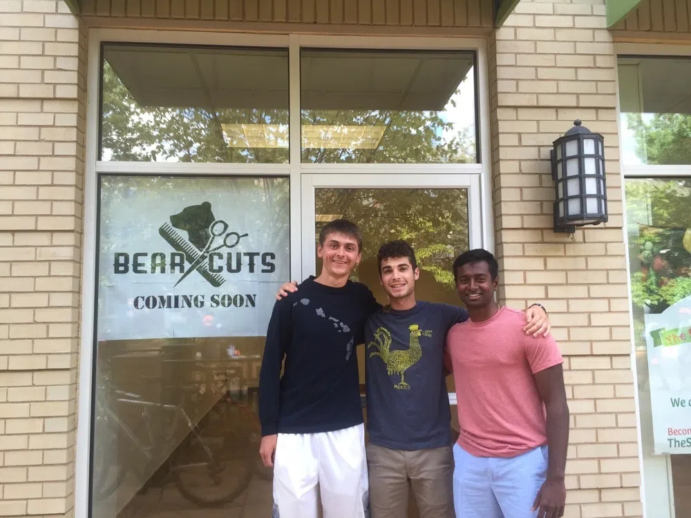 Students stand outside of "Bear Cuts", a student run business in the Gregg Storefronts