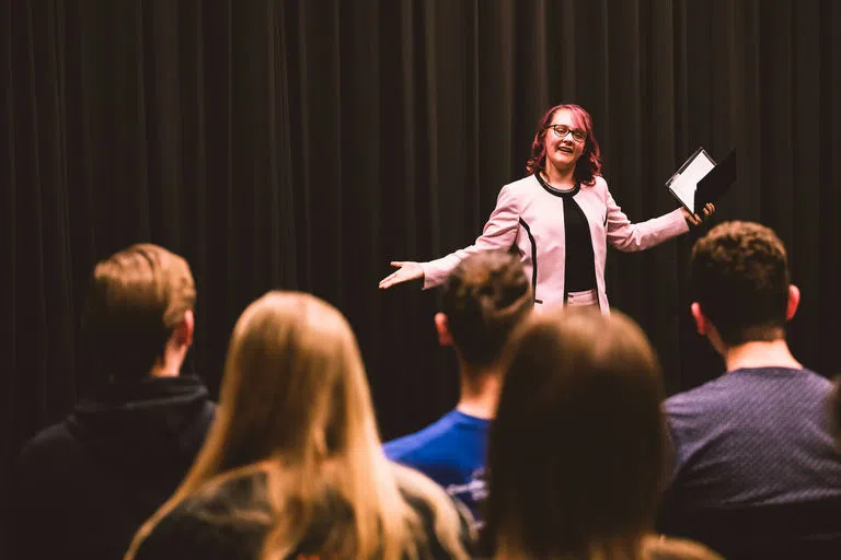 Female student giving speech presentation