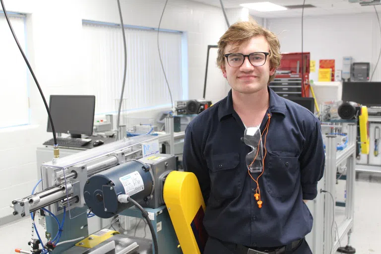 Industrial Maintenance student in motors control lab.