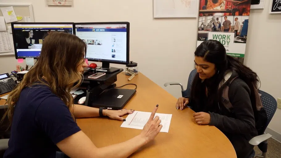 Student receives assistance in the Financial Aid office.