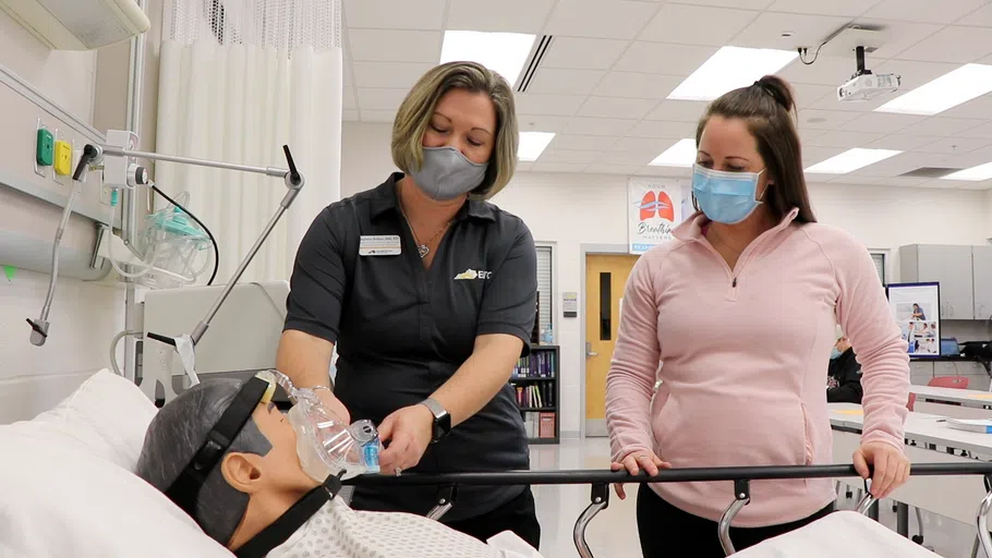 Respiratory Care student learns how to properly fit a facial mask. 