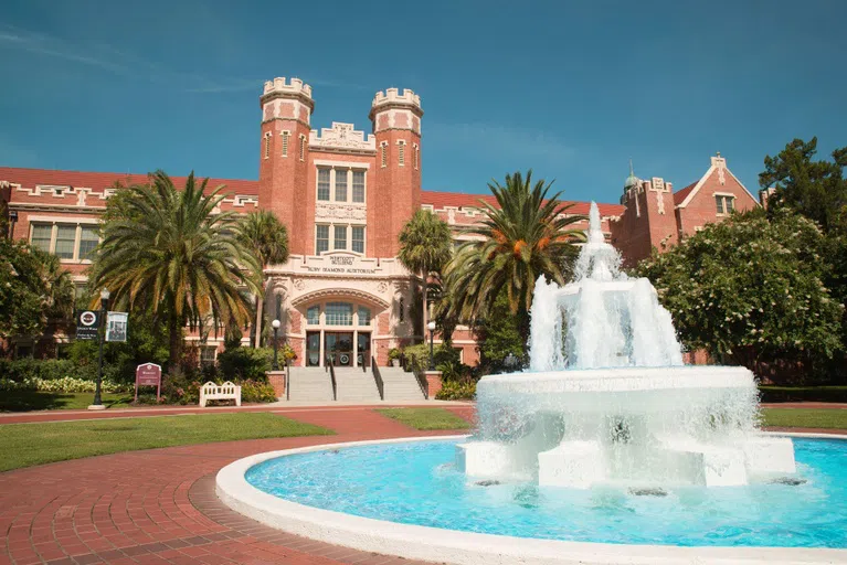 The plaza in front of the building is an iconic spot on campus. Originally, the iron archway served as the main entrance to our campus and was a gift from the classes of 1916 and 1918. The Westcott Fountain in the middle was also a gift from the classes of 1915 and 1917. Since its installation, the fountain has been a symbol of Florida State’s proud heritage and pays homage to those who came before.   