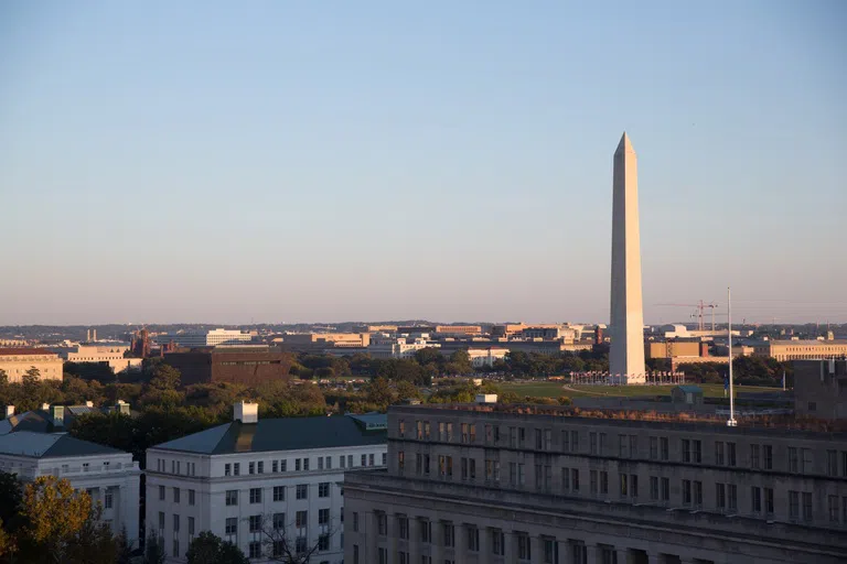 Outdoor rooftop view of the Washington Monument from the City View Room.