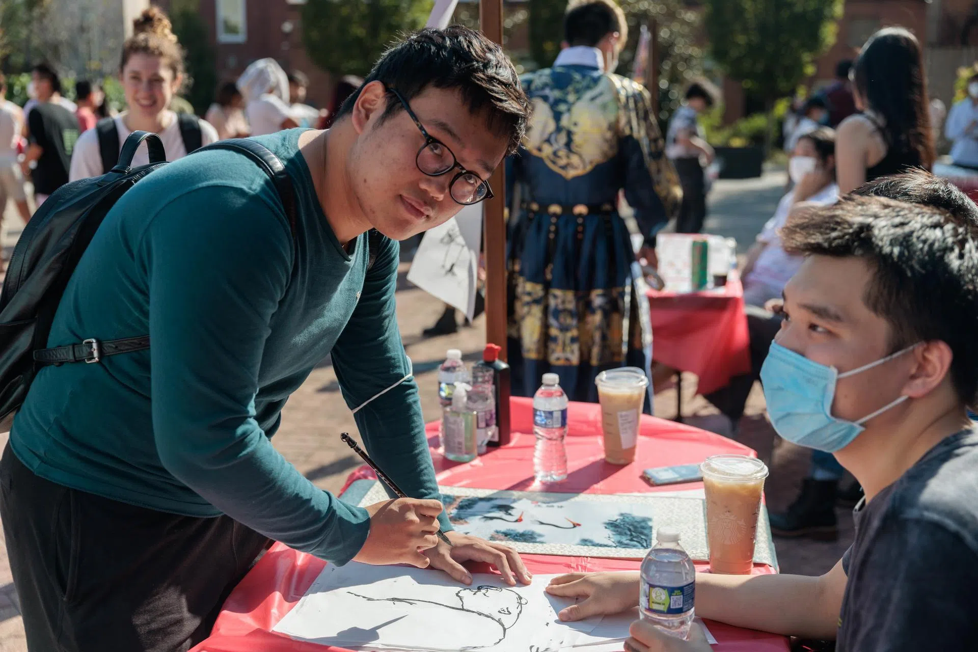 A student at an art station in Kogan Plaza