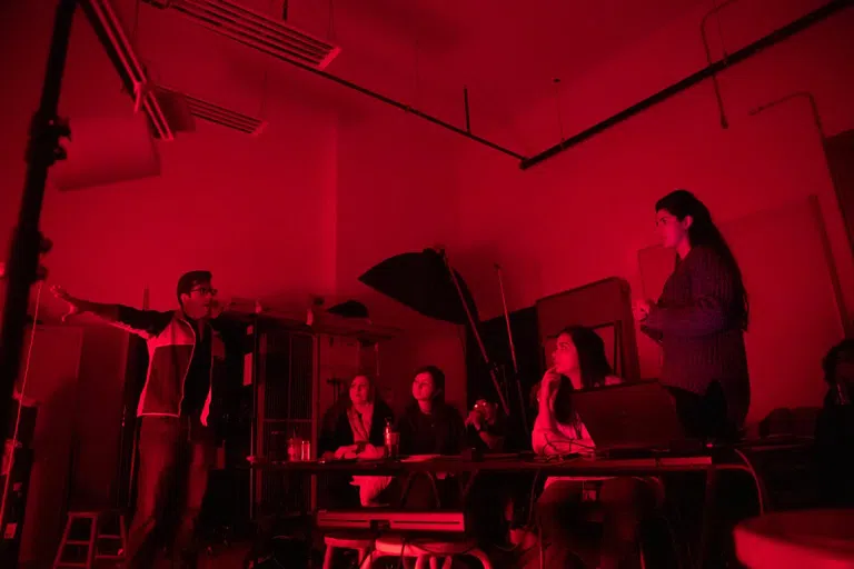 Students at a table in a Lighting Design lab