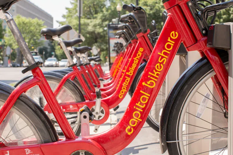 Stock Image of Capital Bikeshare bikes docked in station.