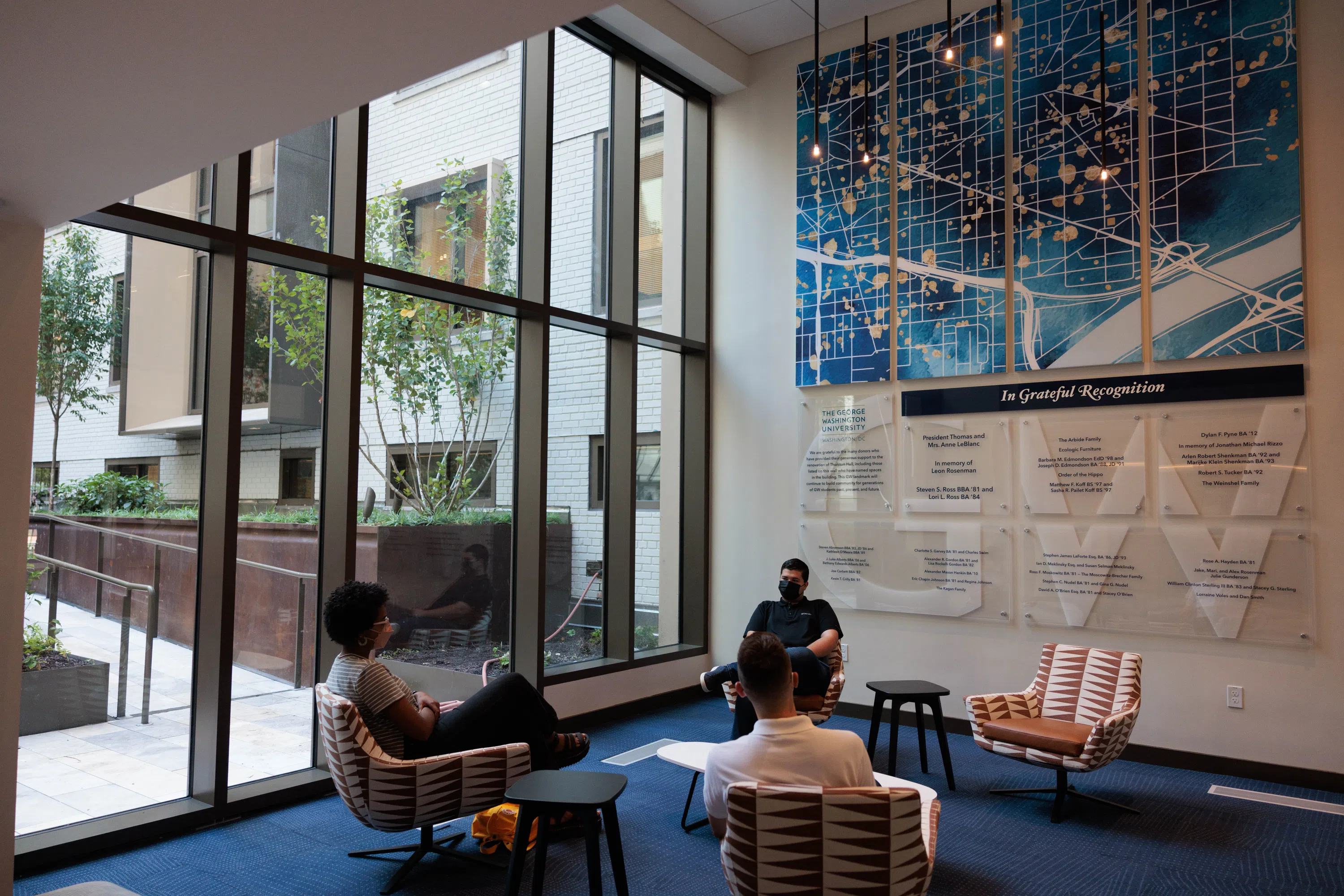 Students sitting in a community space in Thurston Hall