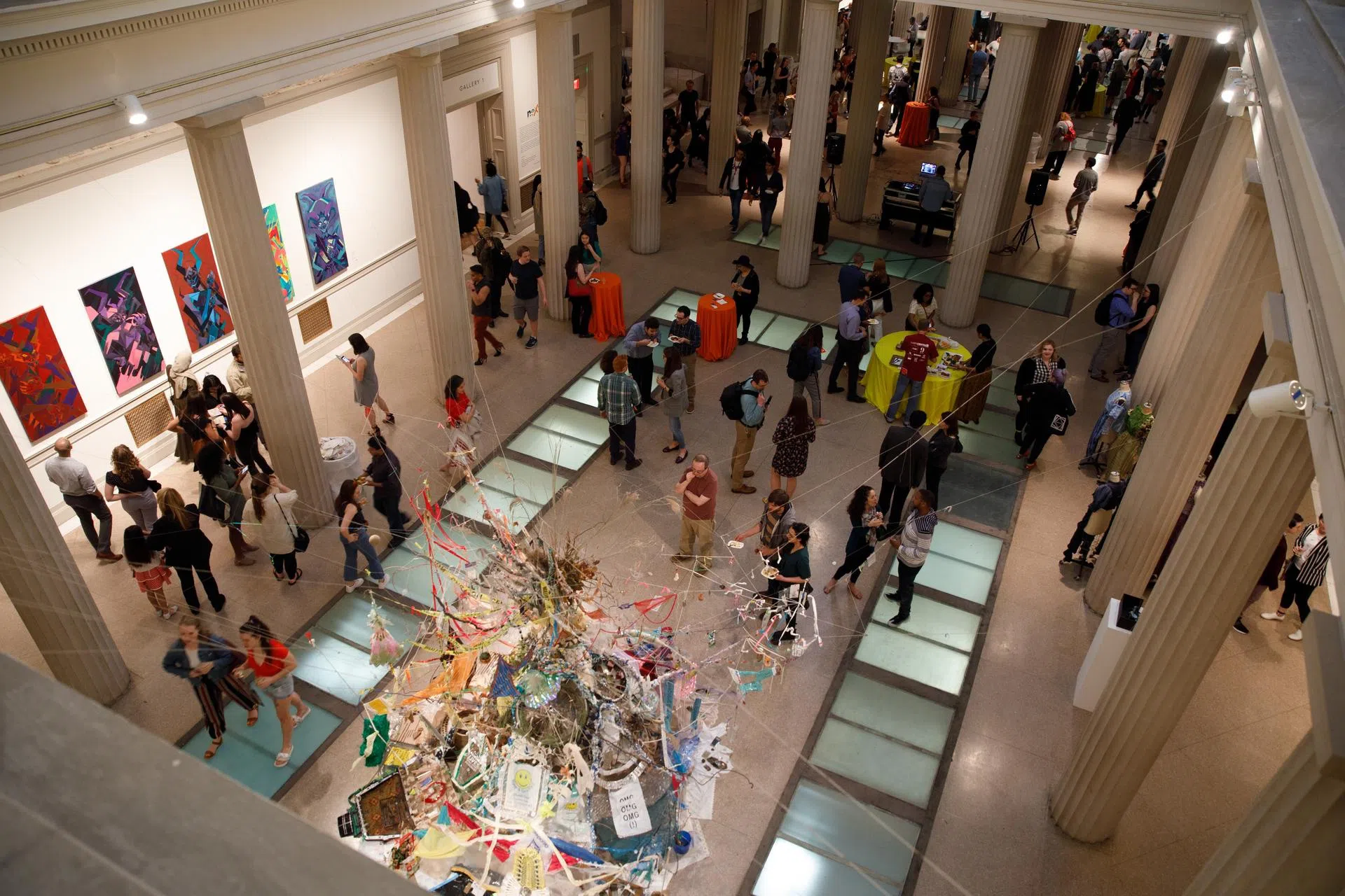 View of the Corcoran's gallery space from above with student art on the main level