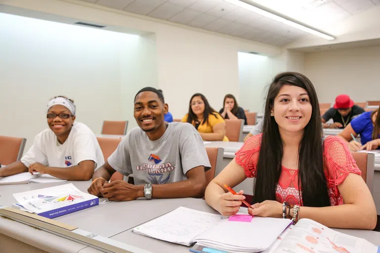 Students listen to a lecture in classroom setting