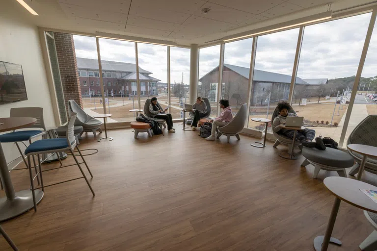 Students gather to relax and study in the common area