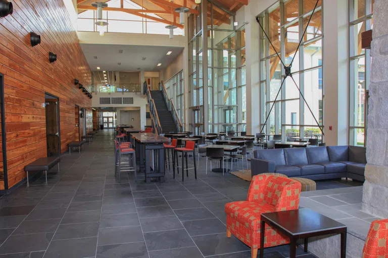 Chairs and tables in the common area in Building B