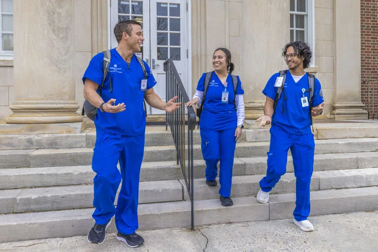 Nursing students in front of Heritage Hall