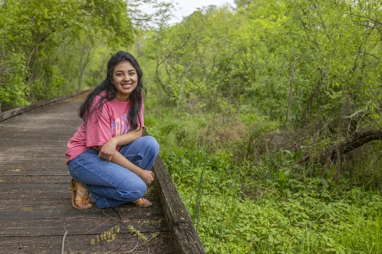 Student spending time in the wetlands