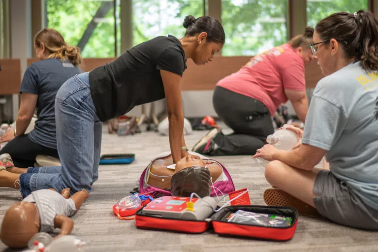 Students practice CPR 