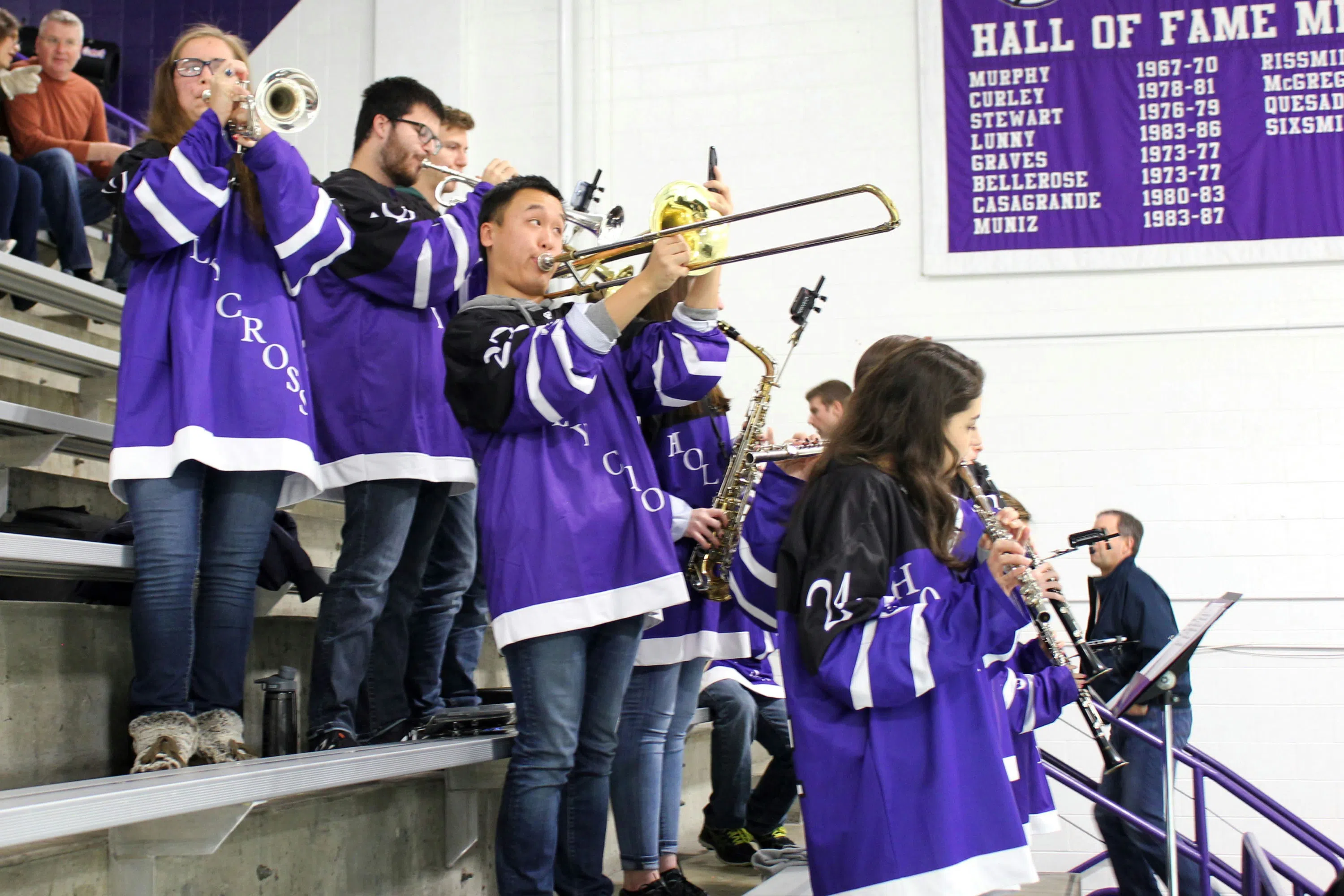 Student pep band performing in hockey rink