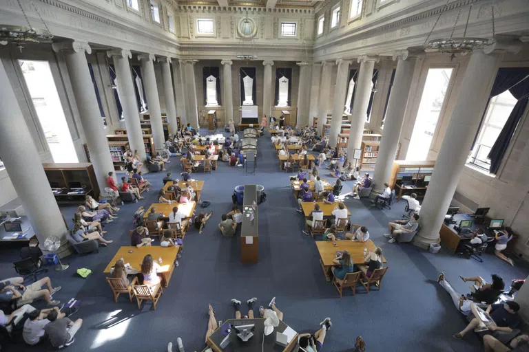 Students studying in main reading room