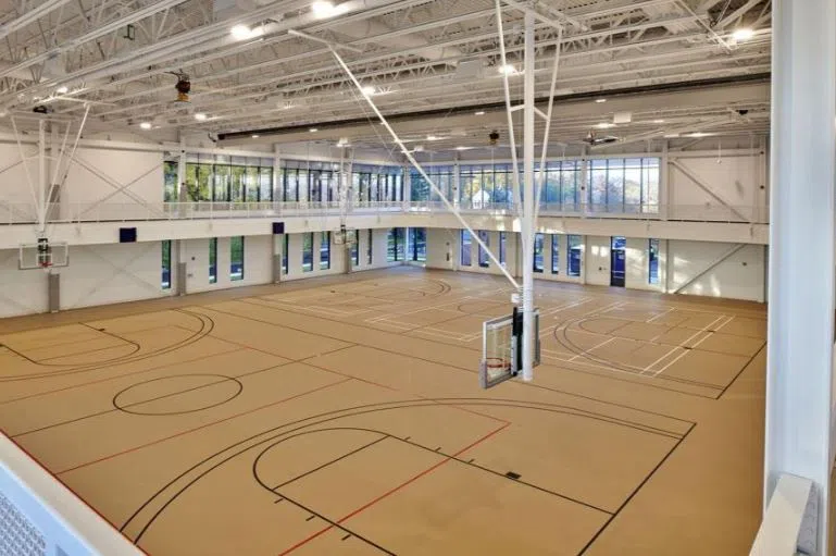 Gymnasium courts featuring basketball, volleyball and badminton courts.