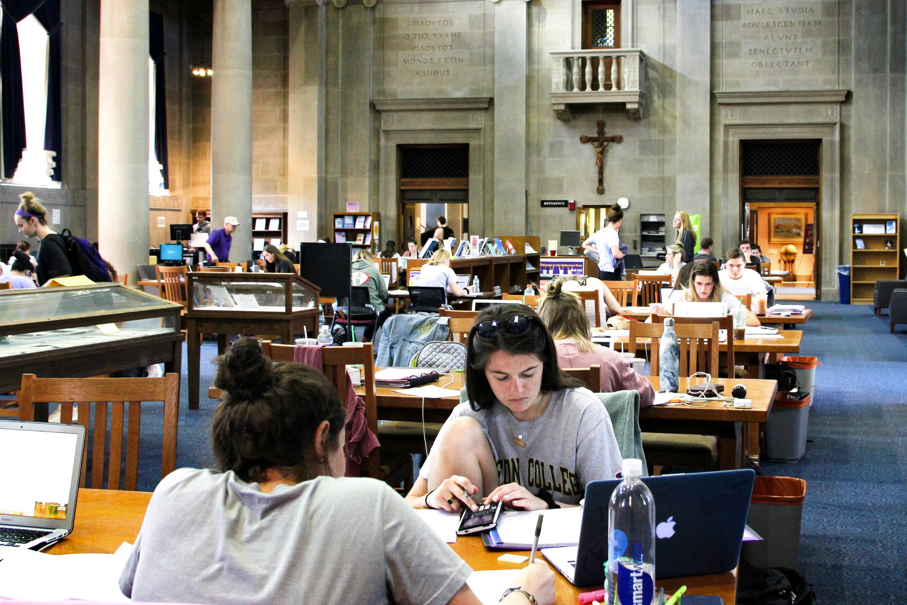 students study in large library room