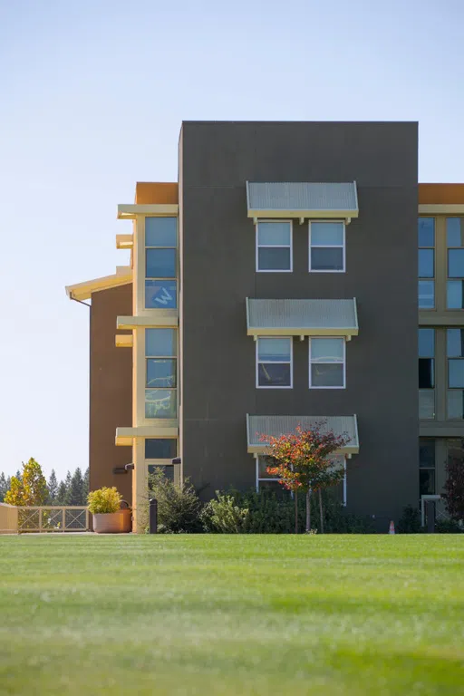 Exterior of Block building with recreation fields and landscaping 