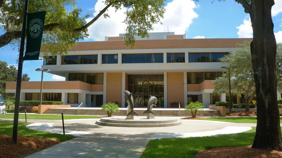 The outside of Howard Administration Building with the Dolphin Statues. 