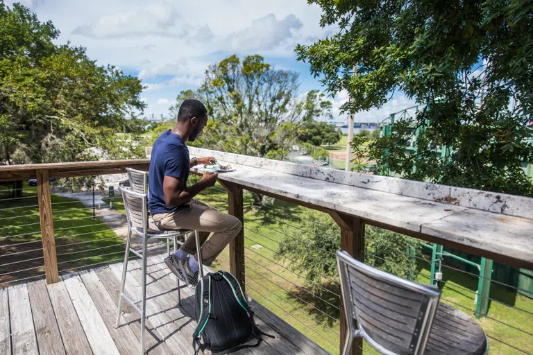 Student eating outside on the deck. 