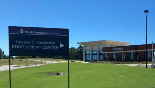 Wayfinding sign for the Enrollment Center located at Peyton T. Anderson.