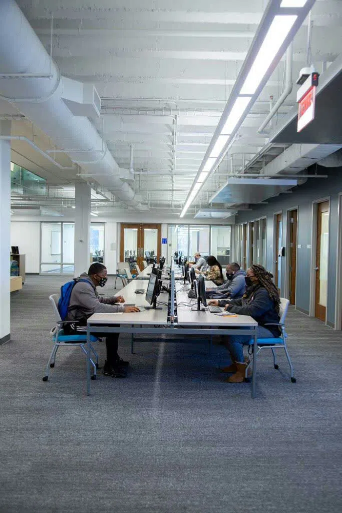 Several students use computer stations located at the library.