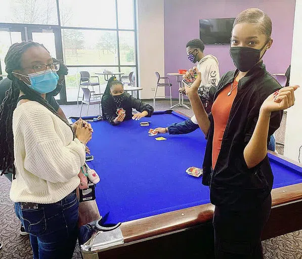 Students play pool in the gameroom.