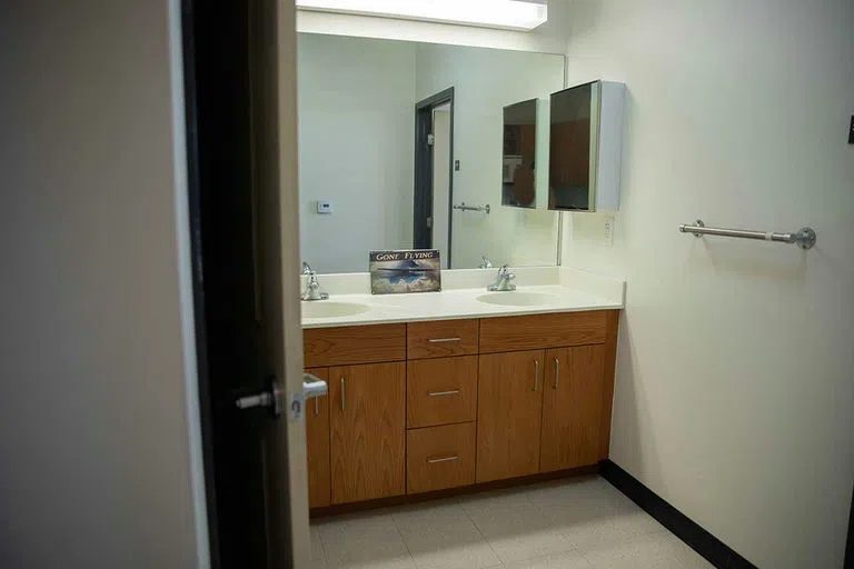 The interior of a dorm suite restroom.