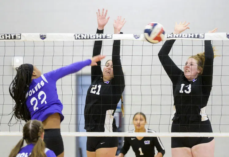 Student-athletes play volleyball game.