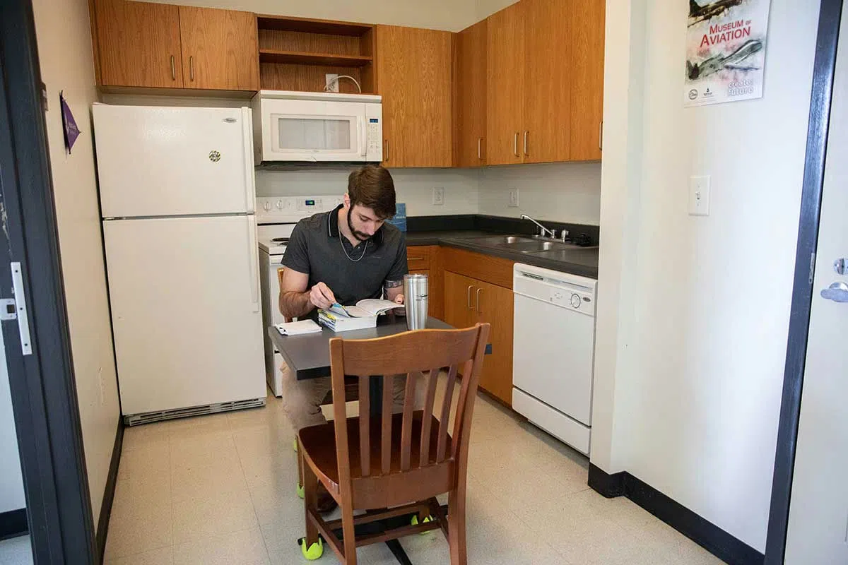 Student dines at kitchenette.