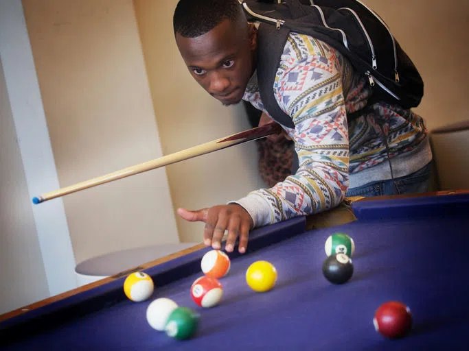 Student plays pool.