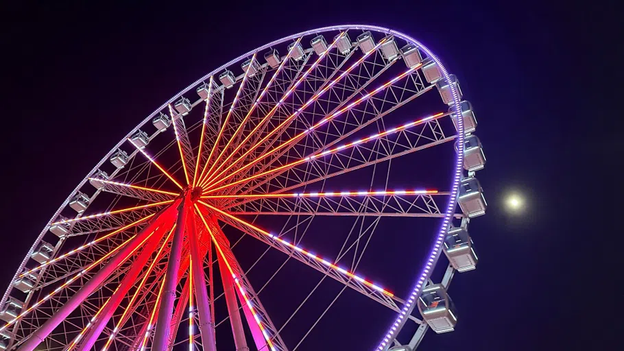 The Ferris Wheel lit up at night