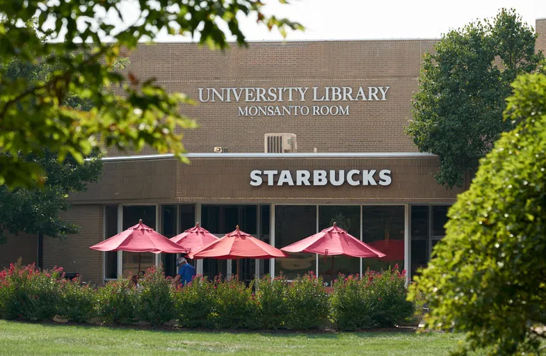 The exterior of the library building, including Starbucks.