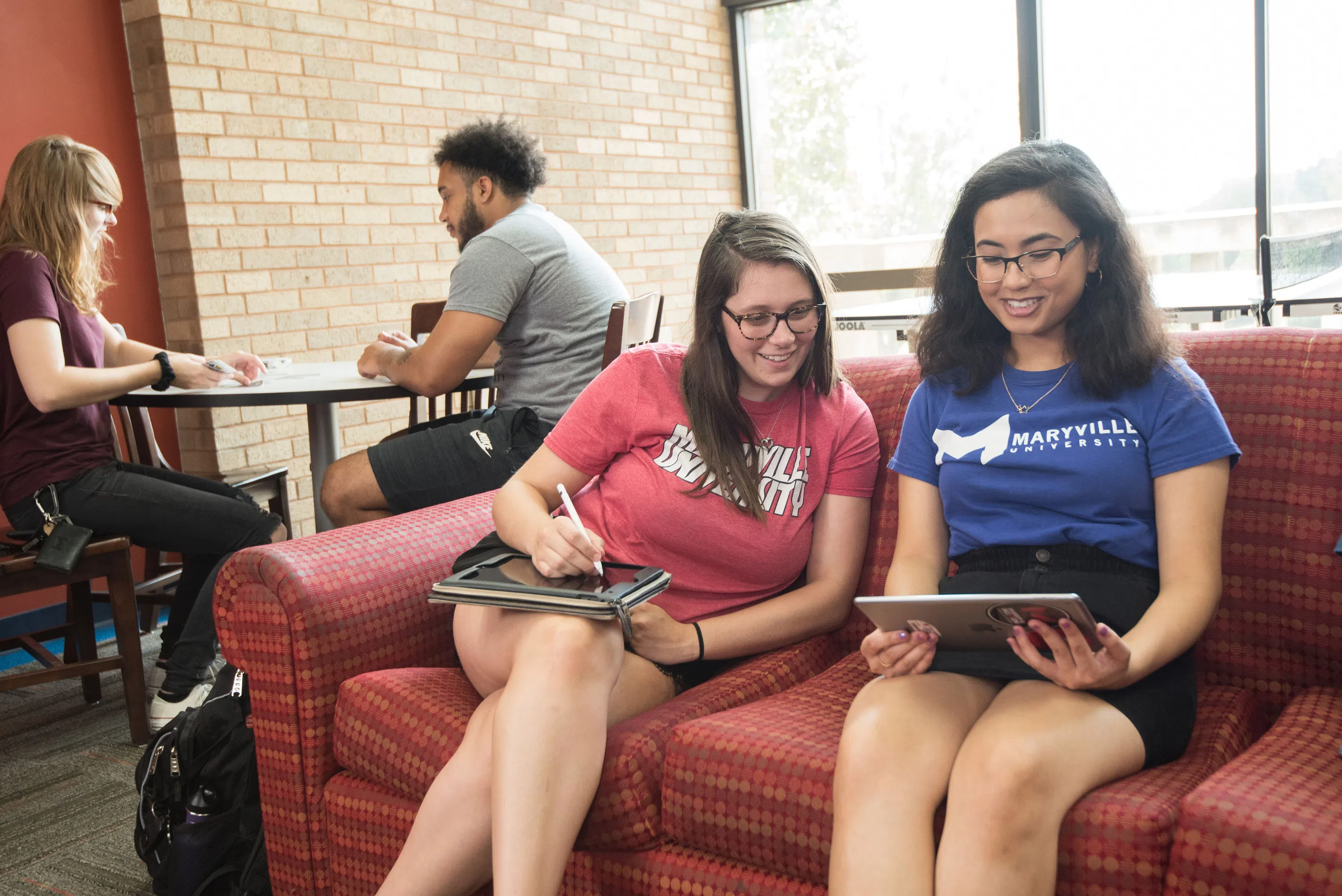 Students in a lounge area in Mouton Hall.