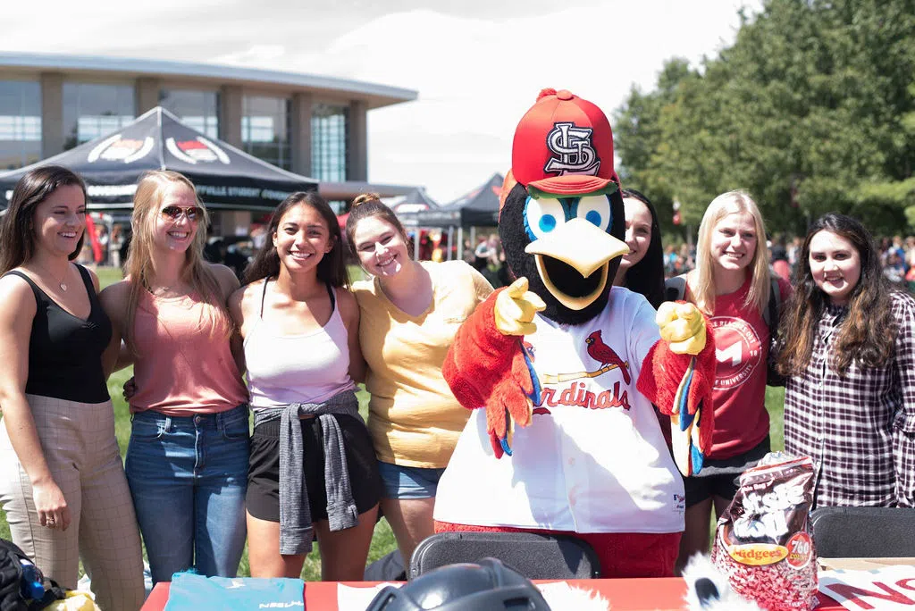 Fredbird joins some students on the quad for the Involvement Fair. 