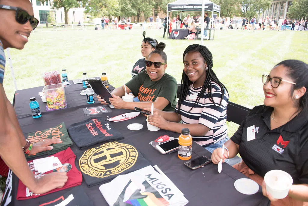 Student leaders recruit new members for their organizations at the involvement fair. 