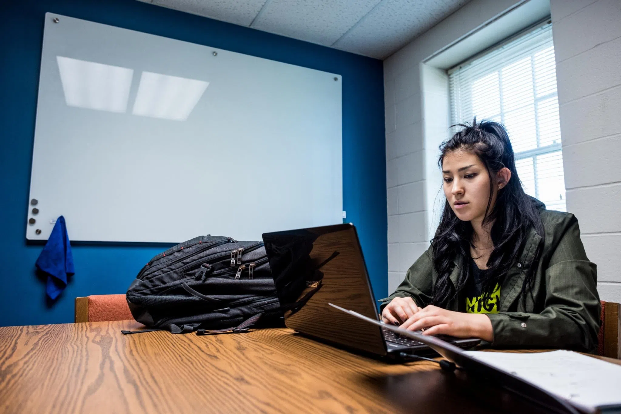 Student works at a laptop 