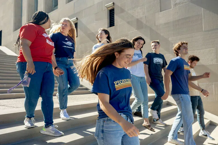 Students walk down the stairs at the WWI Memorial and Museum