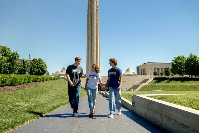 Student walk downtown KC with the WWI Memorial Tower in the background