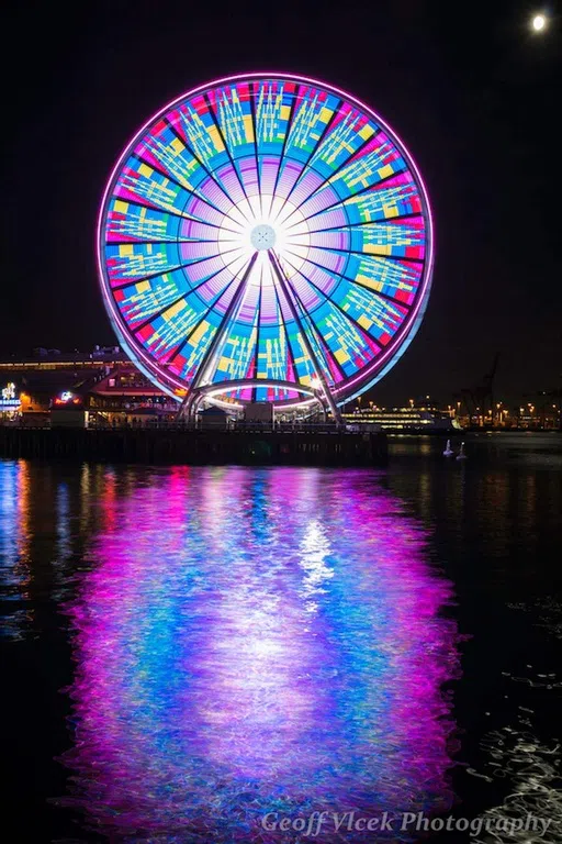 The Great Wheel glowing with LED lights at night. 