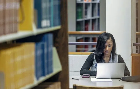 Student works at laptop